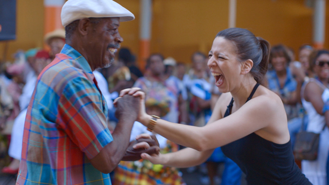 Mickela Mallozzi dancing at Fruit and Vegetable Market in Basse Terre. Image captured by Lina Plioplyte.